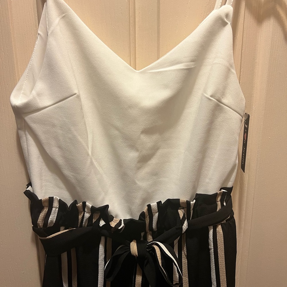 Jumpsuit with white tank top and paper bag style attached pants. NWT.